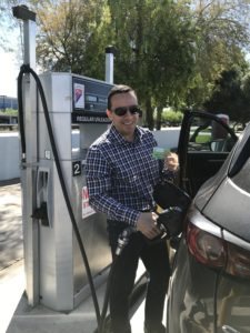 A picture of Founder Chris Hammer fueling his vehicle with his energie·fuel card.