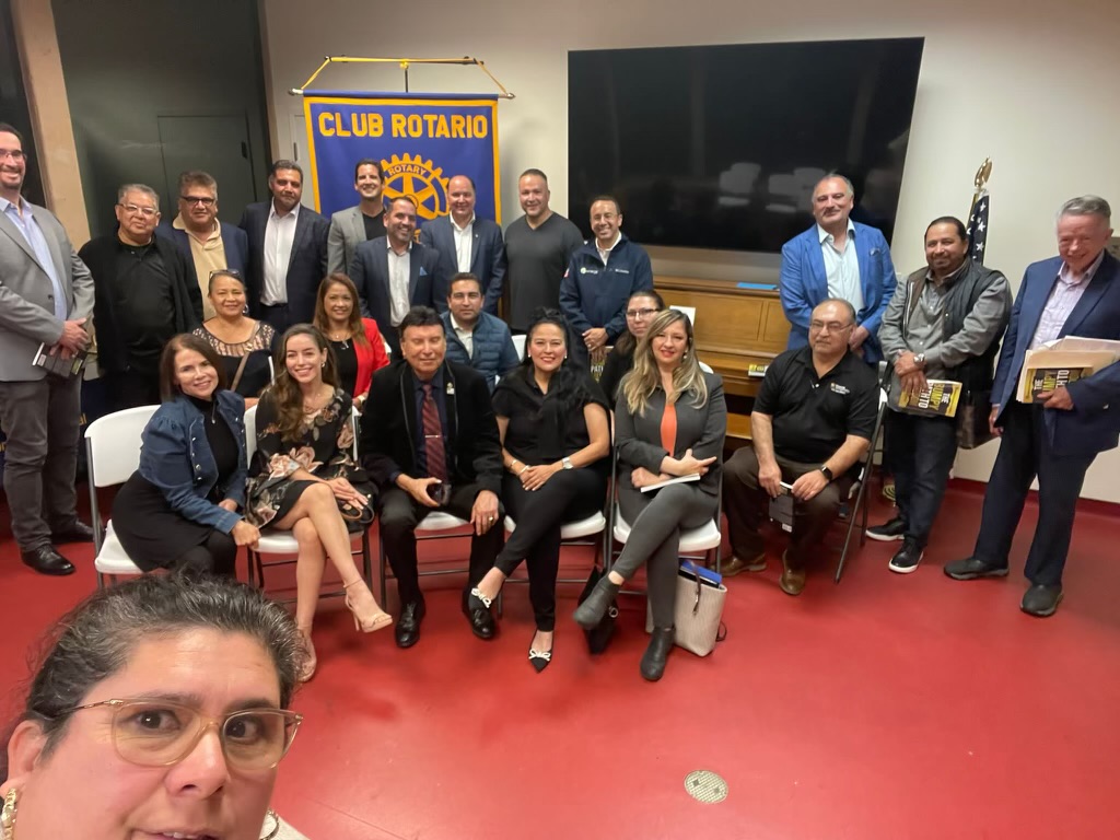 A picture of Founder Chris Hammer among members of a chapter of the Rotary Club in San Diego County.