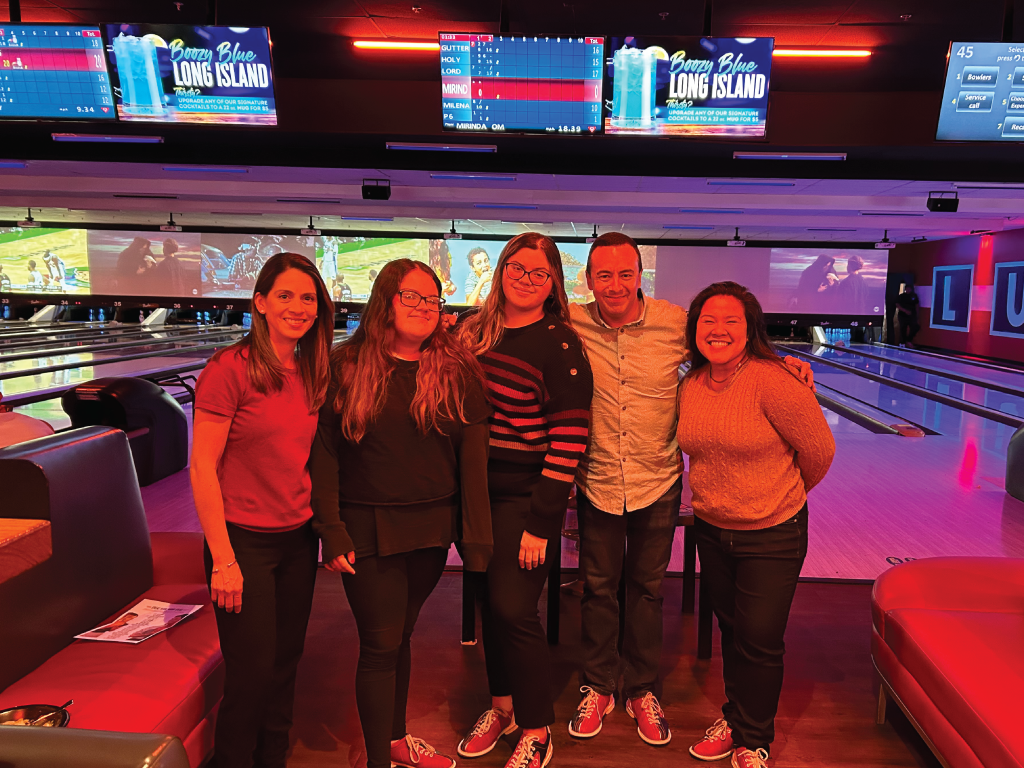 A picture of the full energie·fuel team having fun at a bowling alley to celebrate their hard work.