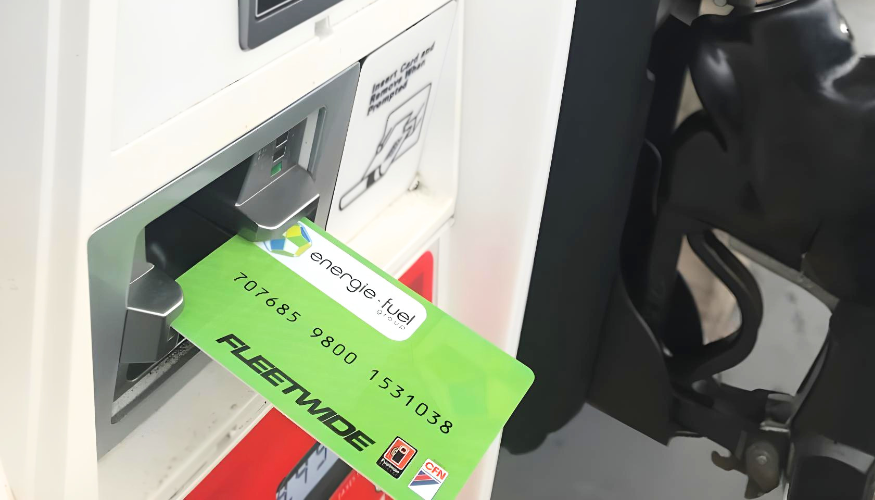 Energie Fuel Card being inserted at the card reader at gas station.