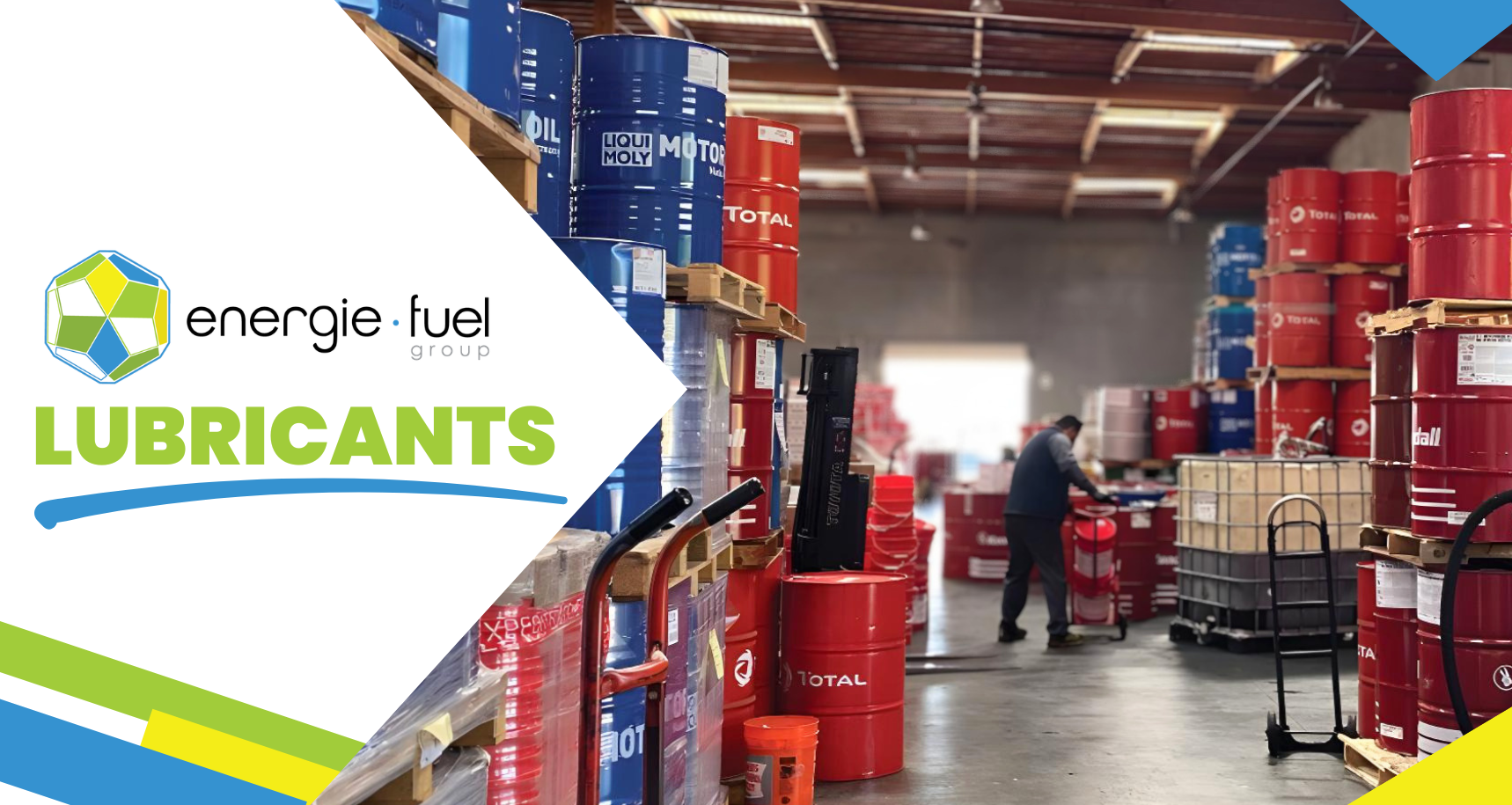 Hero image for Energie Fuel Group’s lubricant products and services. The left side features the company logo and the title “LUBRICANTS” in large green text on a white geometric background with blue, green, and yellow brand accents. The right side shows a warehouse stocked with industrial lubricant and motor oil drums in blue and red, stacked on pallets and shelving. A worker is visible in the background handling inventory, highlighting bulk lubricant storage, distribution, and supply operations.